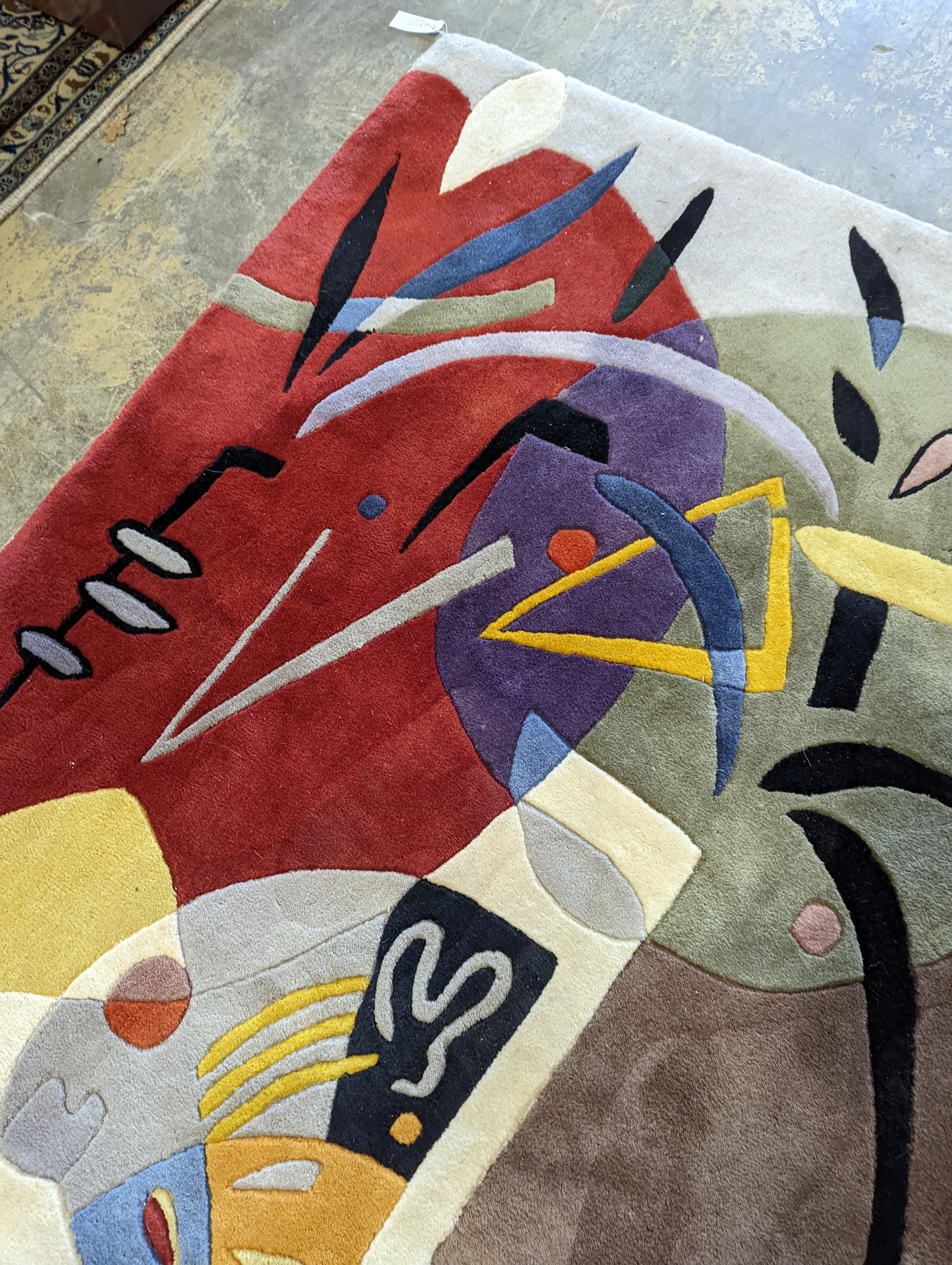 A contemporary Picasso inspired polychrome abstract pattern rug, 246 x 160cm